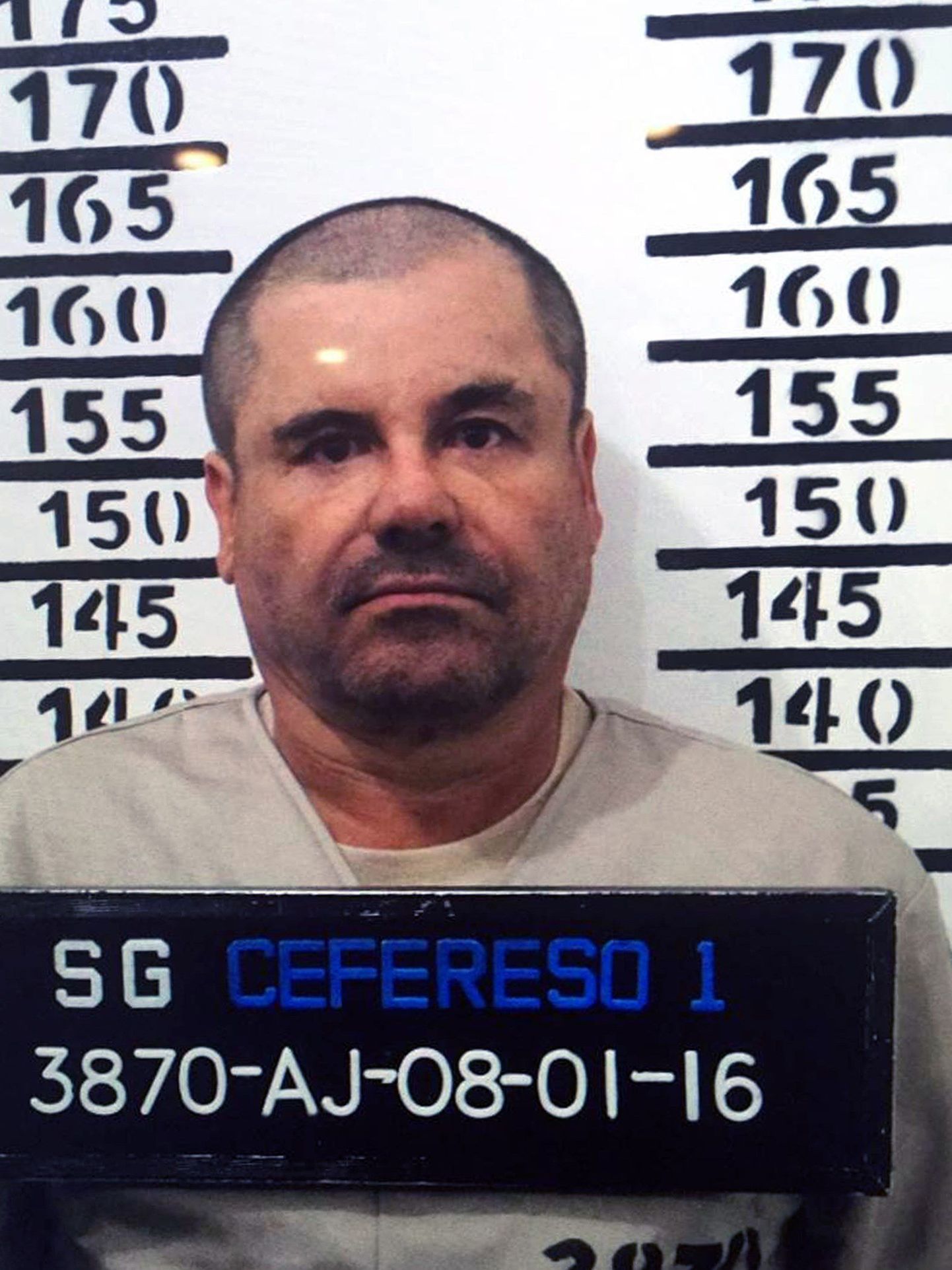 Handout police photograph of Joaquin Guzman Loera aka "El Chapo" taken on January 8, 2016, as he was imprisoned in Almoloya de Juarez, Mexico State. Mexican marines recaptured fugitive drug kingpin Joaquin "El Chapo" Guzman on Friday in the northwest of the country, six months after his spectacular prison break embarrassed authorities. AFP PHOTO/OFFICIAL SOURCES