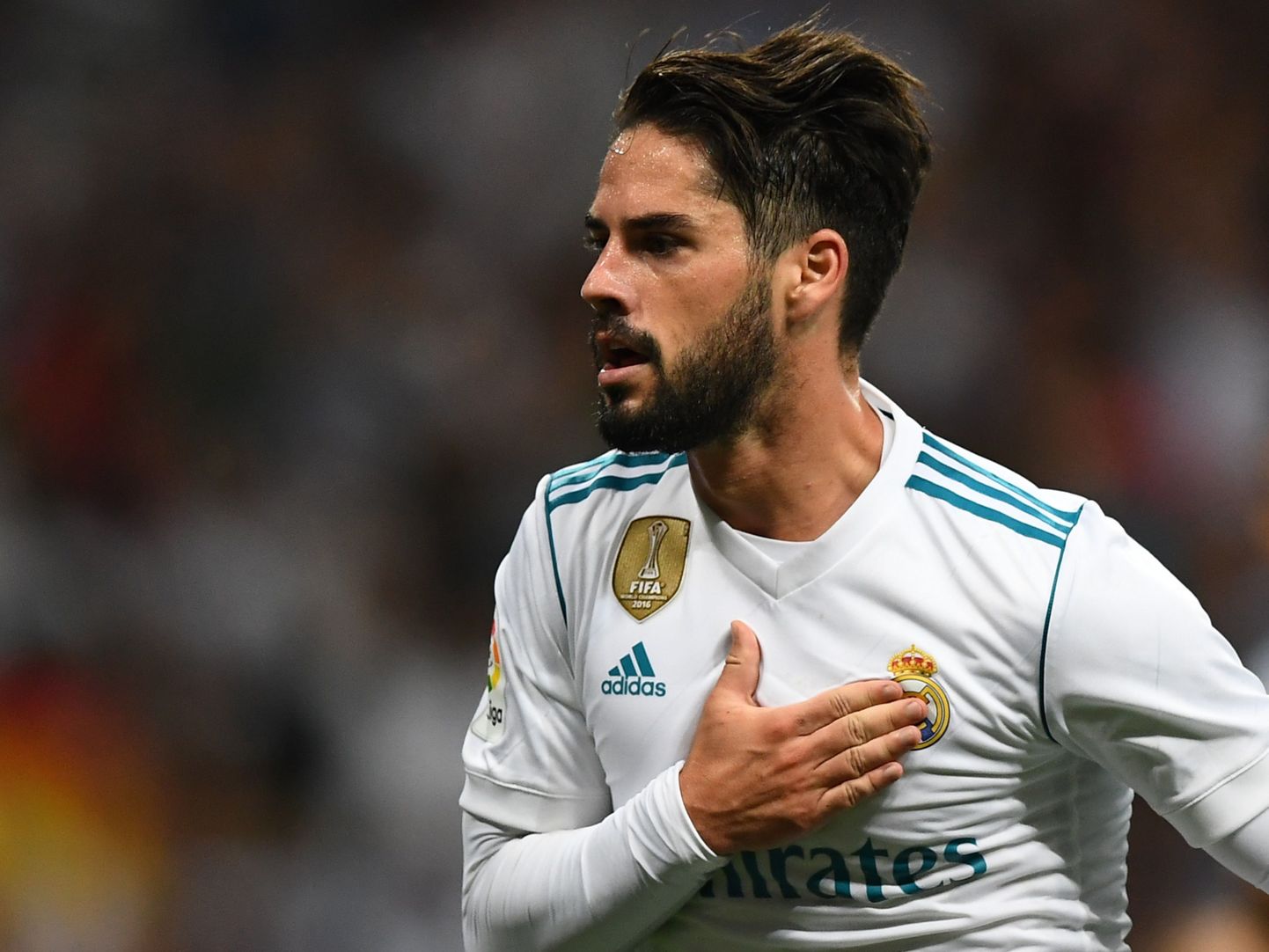 Real Madrid's midfielder Isco celebrates his second goal during the Spanish league football match Real Madrid CF vs RCD Espanyol at the Santiago Bernabeu stadium in Madrid on October 1, 2017. / AFP PHOTO / GABRIEL BOUYS