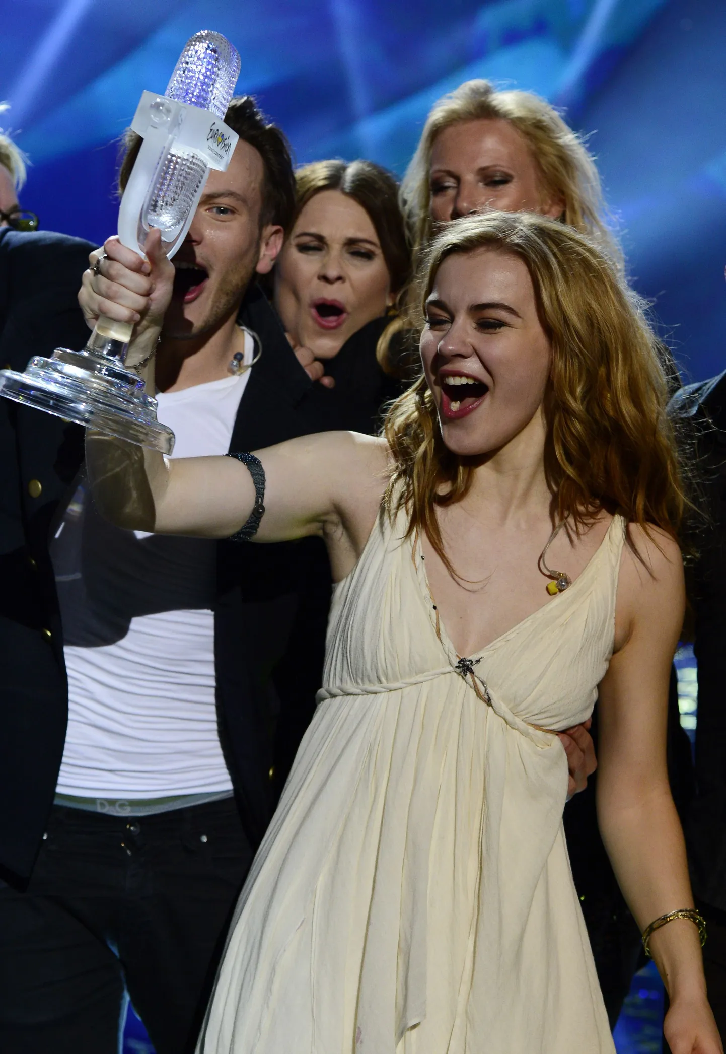 Denmark's Emmelie de Forest raises her prize after winning the final of the 2013 Eurovision Song Contest in Malmoe, Sweden, on May 19, 2013. Denmark won this year's Eurovision Song Contest with the song "Only Teardrops" by Emmelie de Forest. AFP PHOTO / JOHN MACDOUGALL