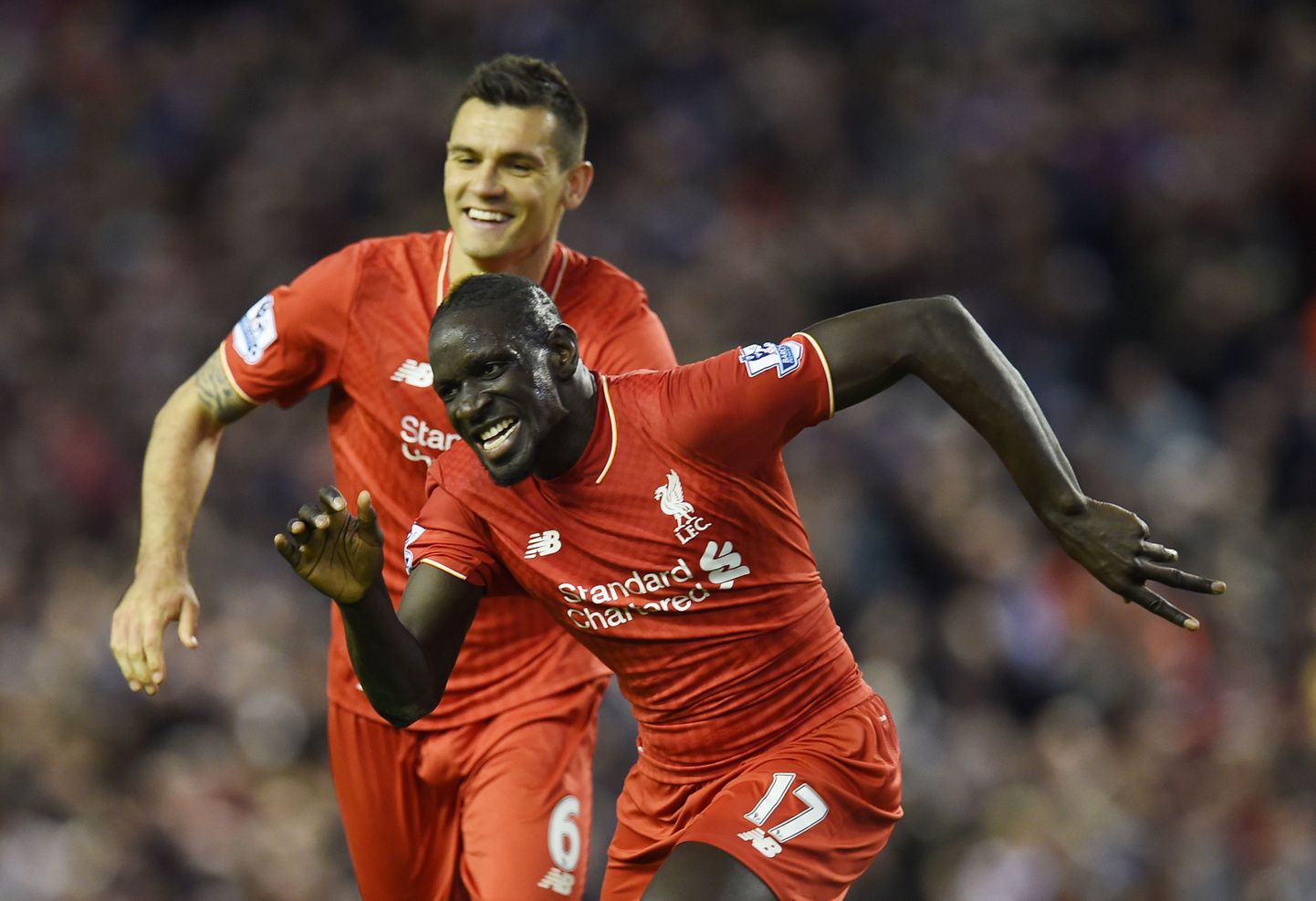 (FILES) This file photo taken on April 20, 2016 shows Liverpool's French defender Mamadou Sakho (R) celebrating with Liverpool's Croatian defender Dejan Lovren after scoring during the English Premier League football match between Liverpool and Everton at Anfield in Liverpool, north west England.
Liverpool defender Mamadou Sakho was on Thursday provisionally suspended for 30 days after failing a drugs test, European football's governing body UEFA announced on April 28, 2016. The France international reportedly tested positive for a fat burner after Liverpool's 1-1 draw against Manchester United in the Europa League on March 17.
 / AFP PHOTO / PAUL ELLIS