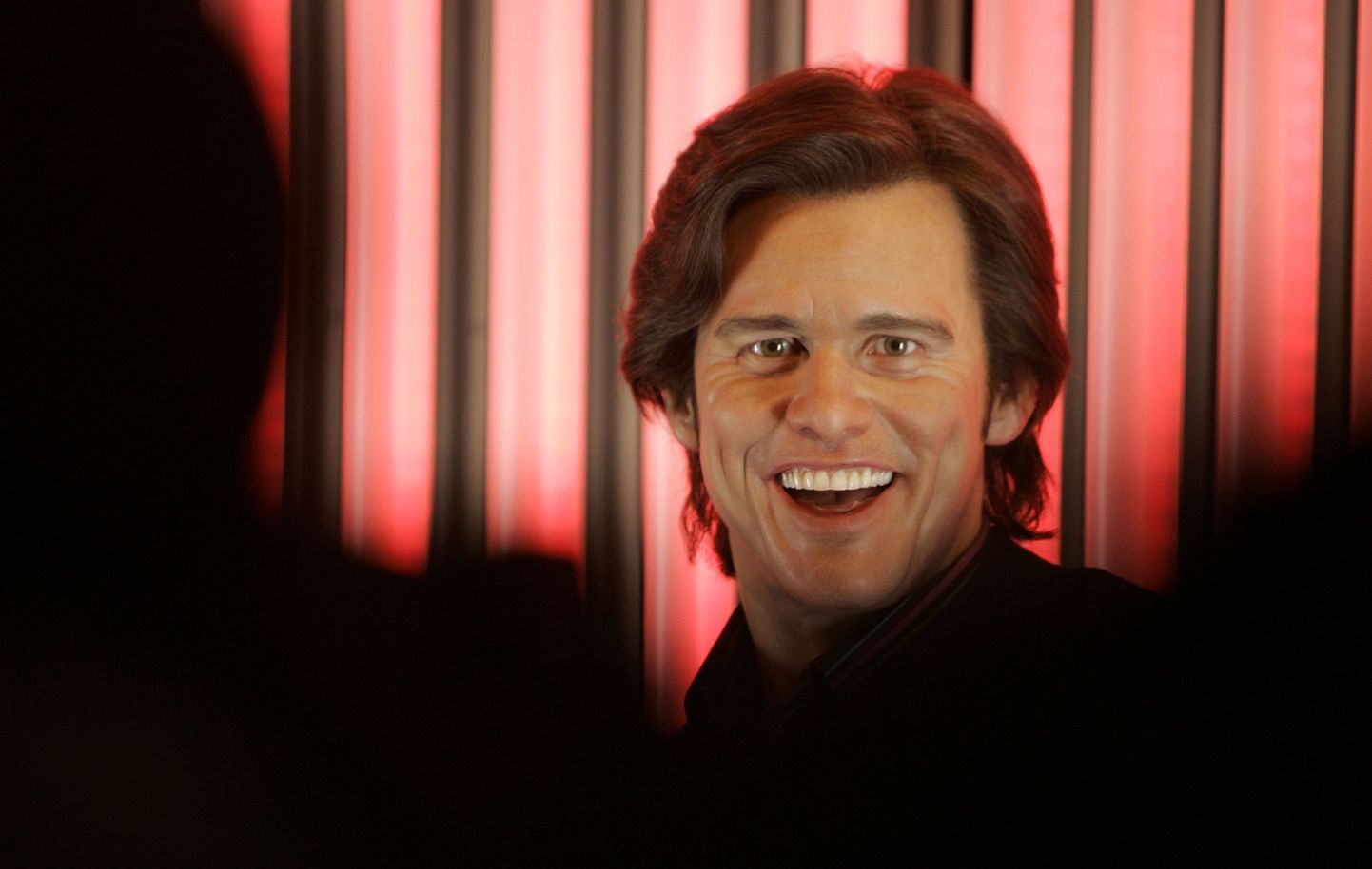 An interactive waxwork of U.S. actor Jim Carrey goes on display at Madame Tussauds museum in London, Thursday, March 13, 2008. The exhibit features a voice changing microphone that can alter visitors voices into three different styles to reflect the many