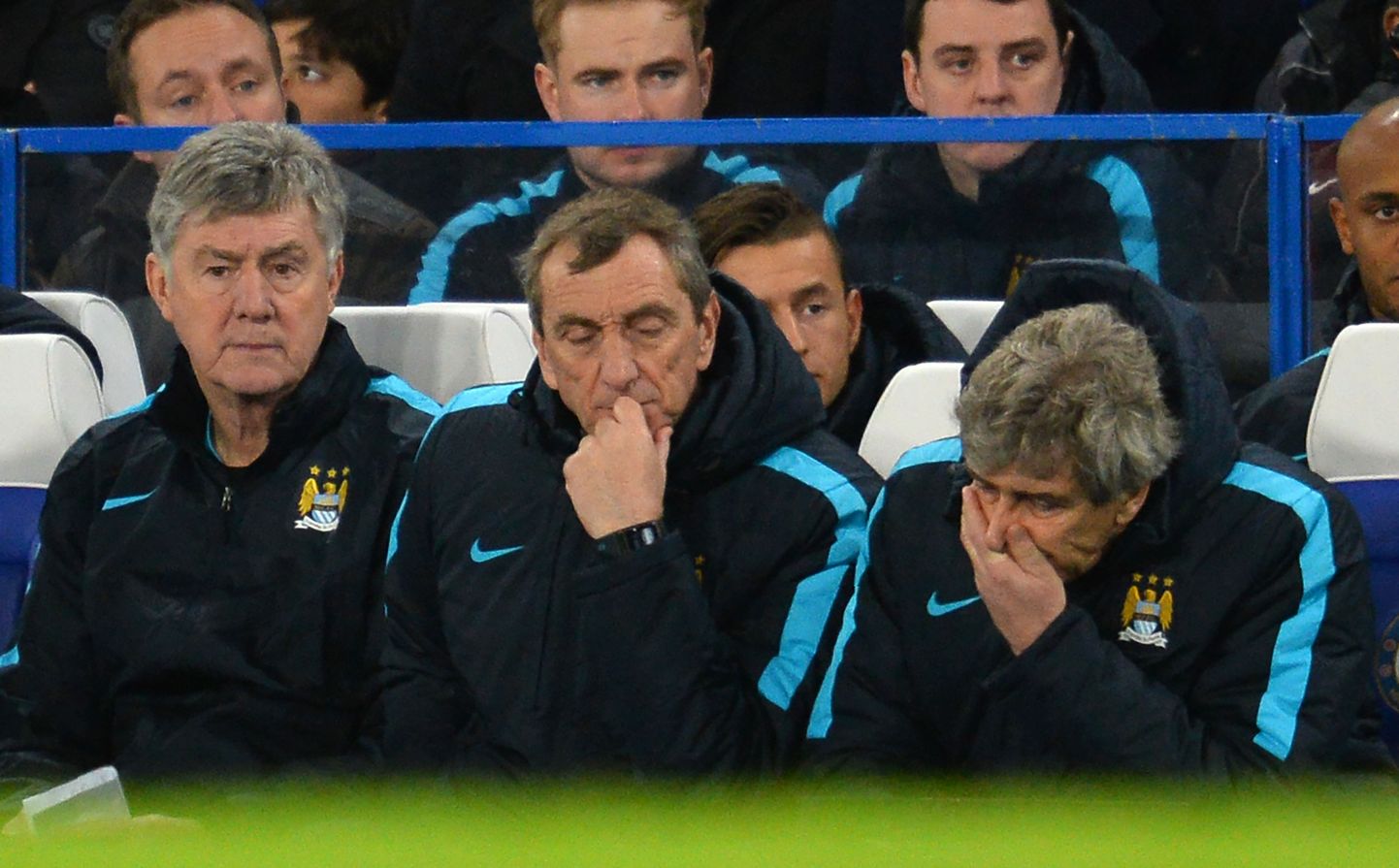Manchester City's Chilean manager Manuel Pellegrini (R), Manchester City's assistant managers Ruben Cousillas (C) and Brian Kidd (L) gesture during the English FA Cup fifth round football match between Chelsea and Manchester City at Stamford Bridge in London on February 21, 2016. Chelsea won the game 5-1. / AFP / GLYN KIRK / RESTRICTED TO EDITORIAL USE. No use with unauthorized audio, video, data, fixture lists, club/league logos or 'live' services. Online in-match use limited to 75 images, no video emulation. No use in betting, games or single club/league/player publications.  /