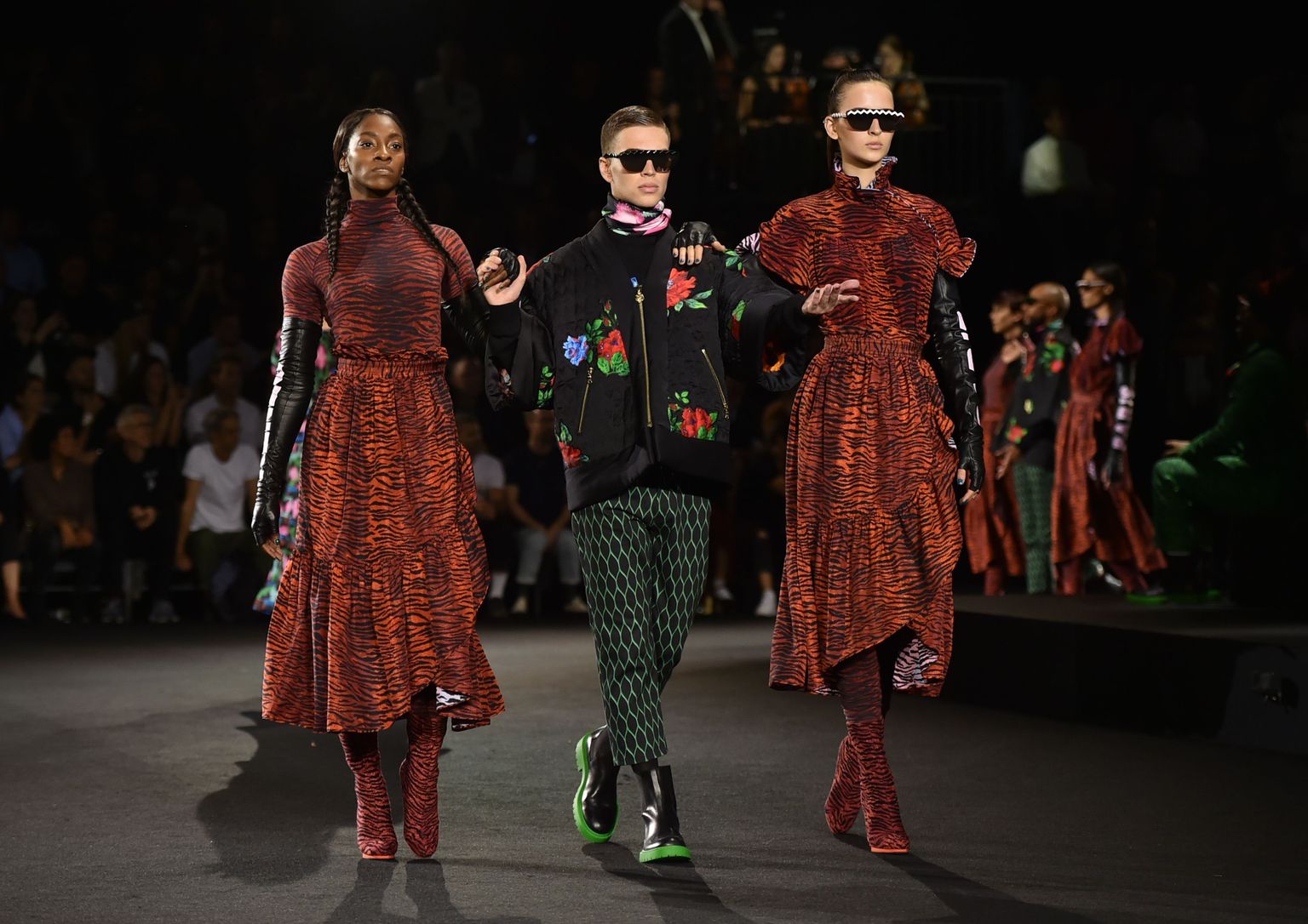 Models walk on runway during the Kenzo x H&M Runway show at Pier 36 on Wednesday, Oct. 19, 2016, in New York. (Photo by Evan Agostini/Invision/AP)