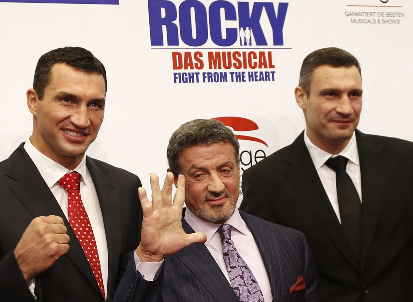Vladimir Klitško (vasakul) koos Sylvester Stallone ja Vitali Klitškoga.