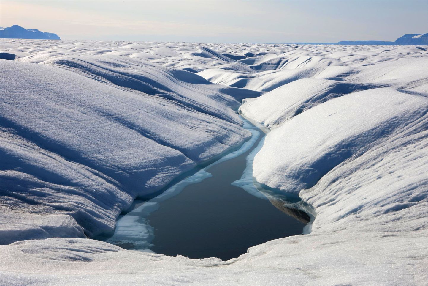 Grenlandes kūstošā ledus sega.