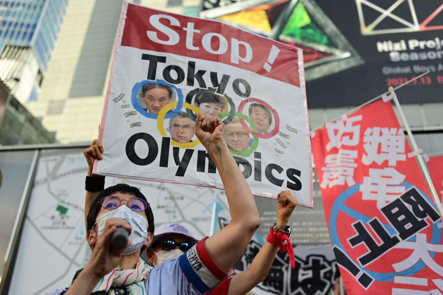 Протест в Токио против Олимпиады.