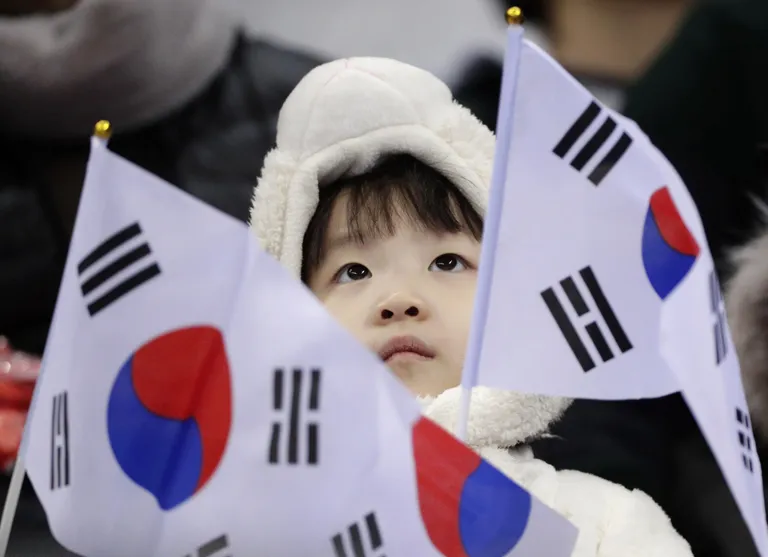 Lõuna-Korea fännid lühiraja kiiruisutamise võistlusel.