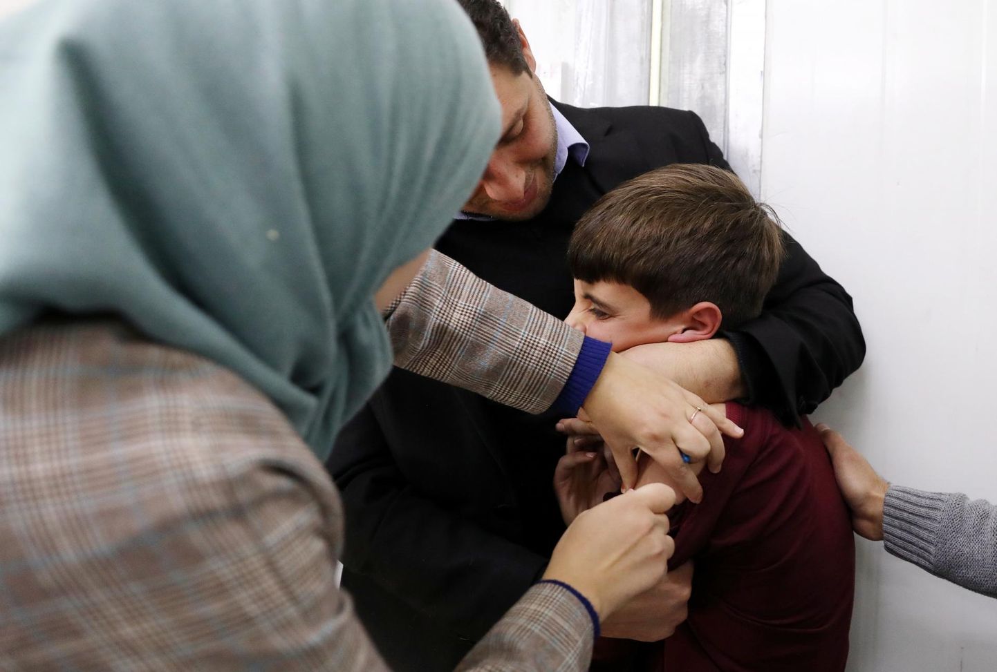 Palestiina laps Hebronis saamas oma esimest vaktsiinidoosi. 