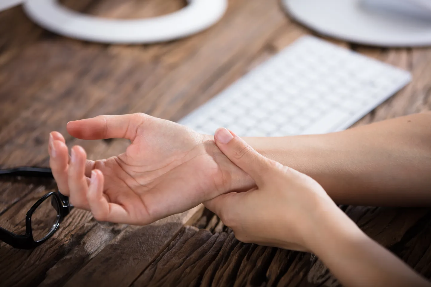 Businessperson Holding Painful Wrist