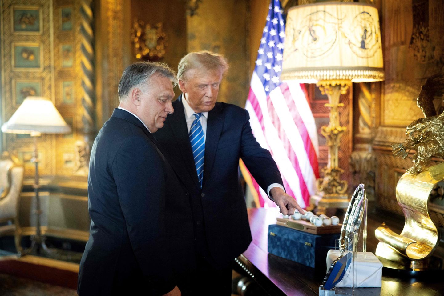 Hungarian Prime Minister Viktor Orban (L) and former US President and Republican presidential candidate, Donald Trump during their meeting at Trump's Mar-a-Lago residence in Palm Beach, Florida.