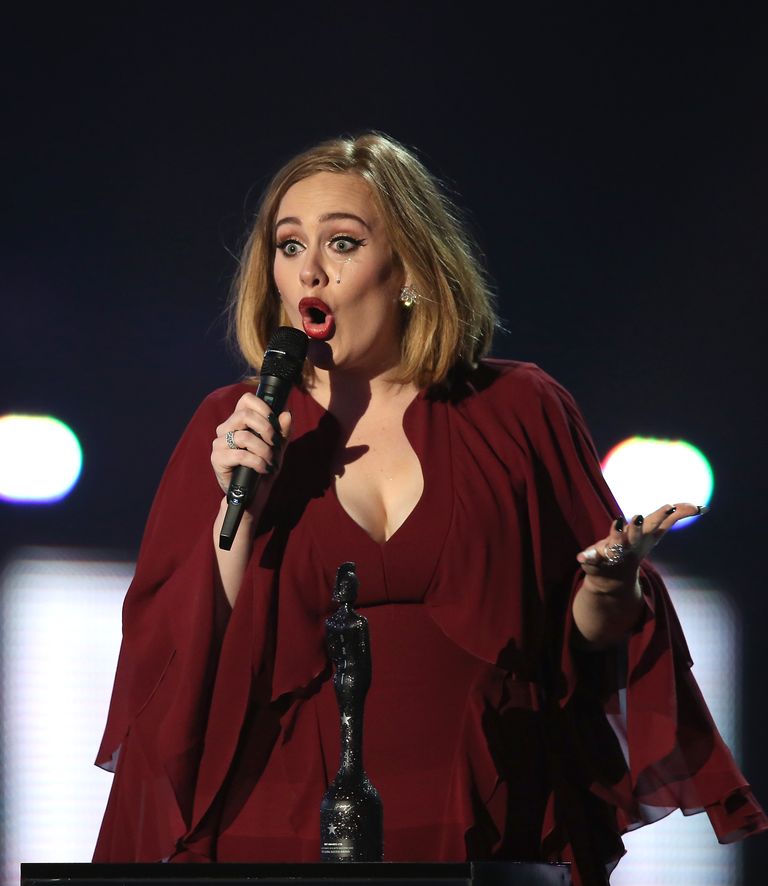 Singer Adele cries as she accepts the award for Global Success onstage at the Brit Awards 2016 at the 02 Arena in London, Wednesday, Feb. 24, 2016. (Photo by Joel Ryan/Invision/AP) Адель
