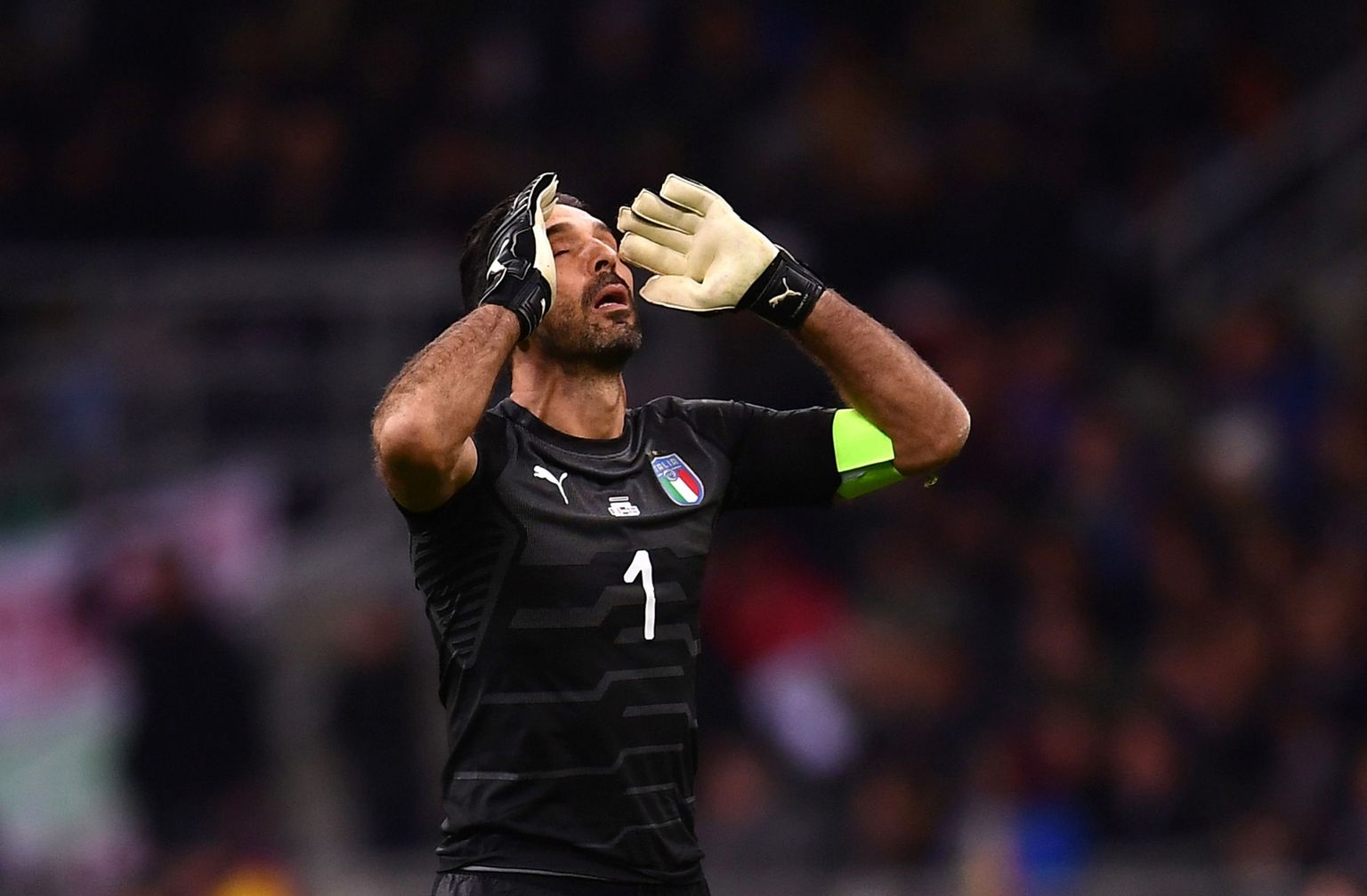 TOPSHOT - Italy's goalkeeper Gianluigi Buffon reacts during the FIFA World Cup 2018 qualification football match between Italy and Sweden, on November 13, 2017 at the San Siro stadium in Milan. / AFP PHOTO / Marco BERTORELLO