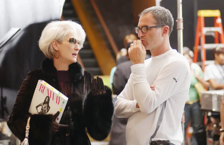 Meryl Streep reviews a scene with director David Frankel on the set of THE DEVIL WEARS PRADA.2006