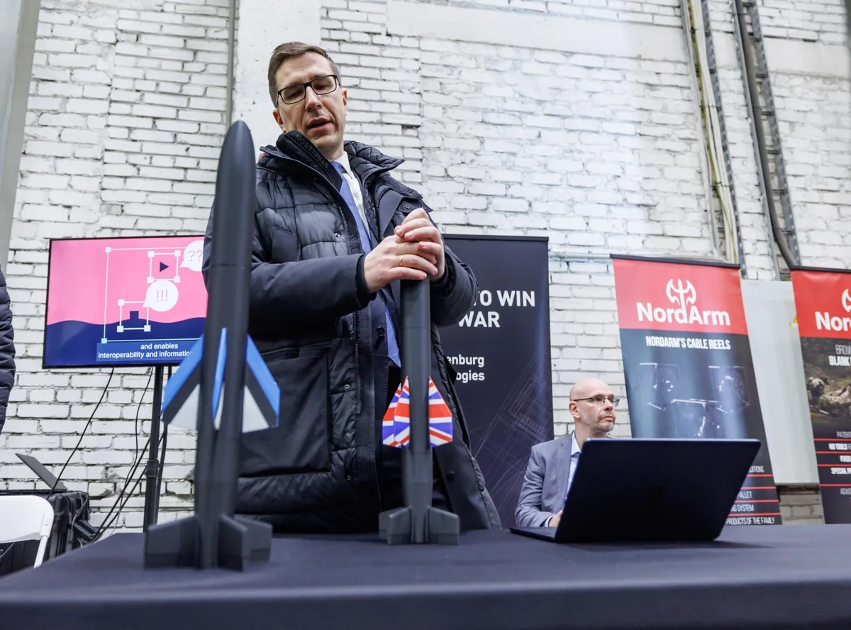 Kusti Salm, a representative of Frankenburg Technologies, speaking on December 18 at the Estonian defense industry companies' exhibition for foreign journalists covering the Joint Expeditionary Force summit.