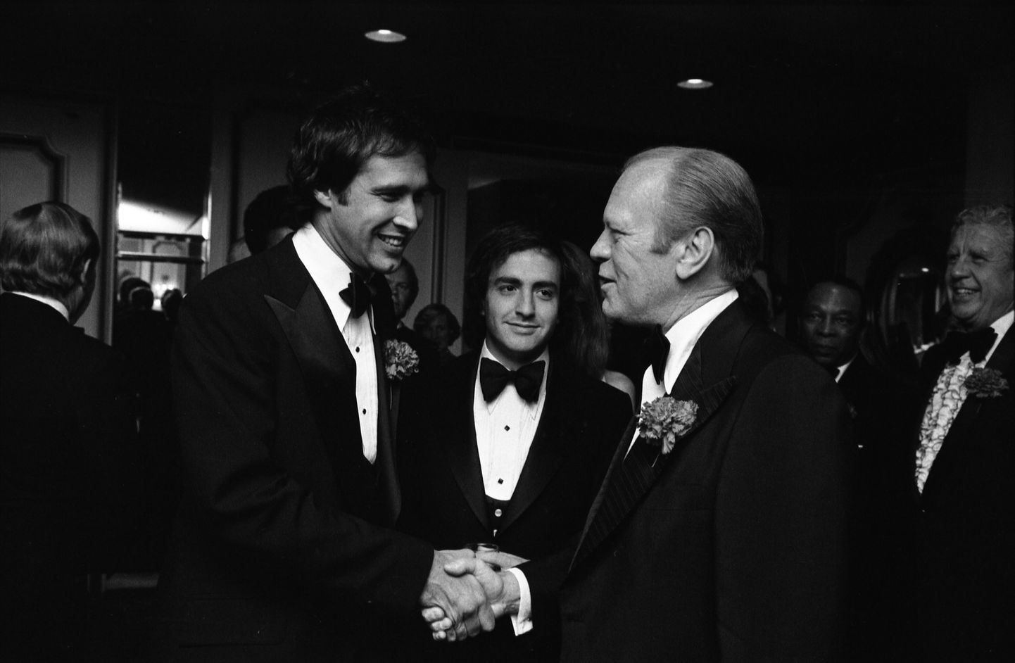 Chevy Chase, «Saturday Night Live'i» produtsent Lorne Michaels ja president Gerald R. Ford 1976. aastal.