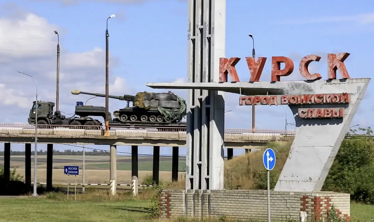 epa11542390 A still image taken from a handout video provided on 10 August 2024 by the Russian Defence Ministry shows Russian troops delivering military equipment to the Kursk region, Russia.