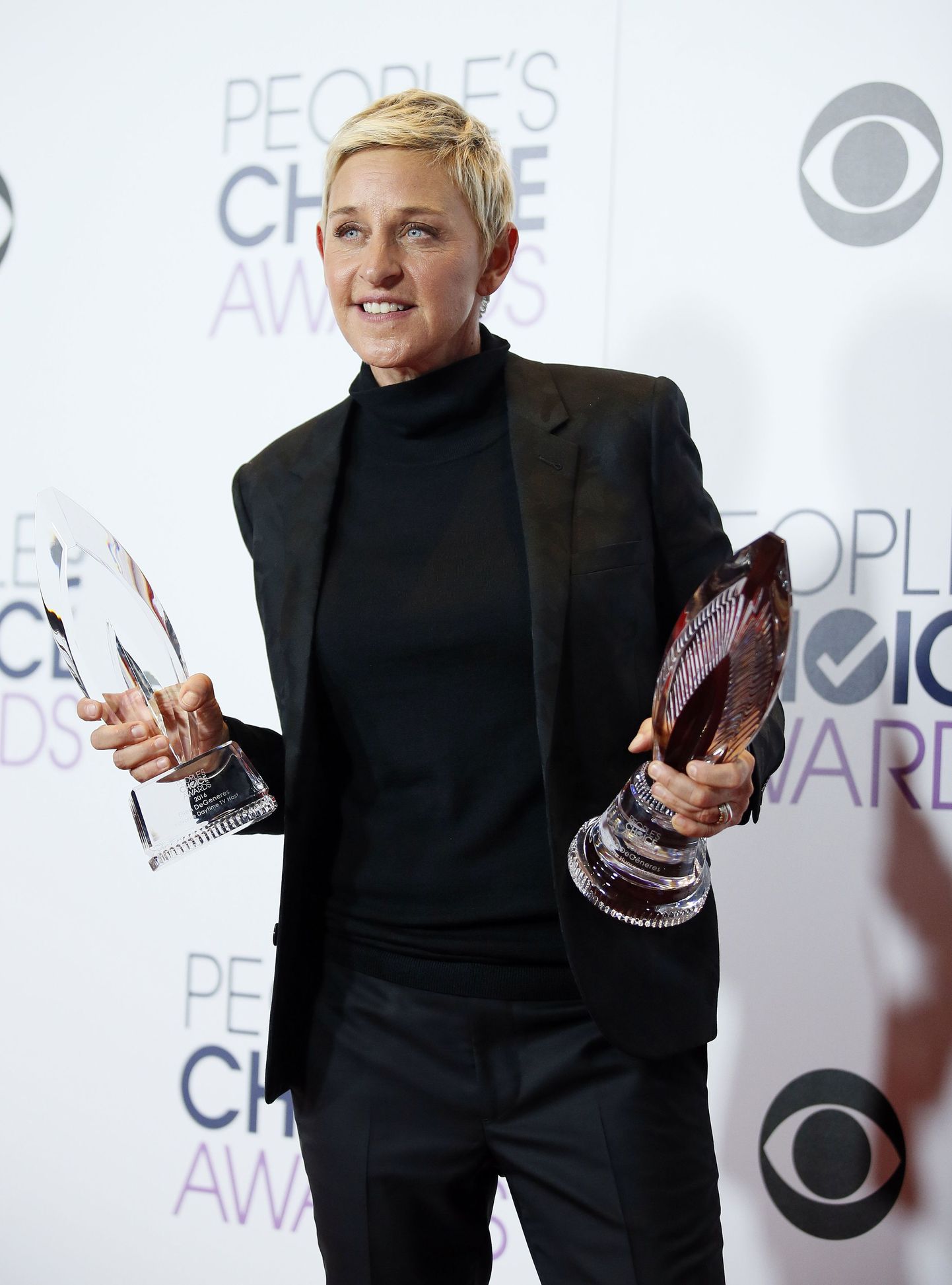 Ellen DeGeneres poses backstage with her Humanitarian Award and Award for Favorite Daytime TV Host during the People's Choice Awards 2016 in Los Angeles, California January 6, 2016.  REUTERS/Danny Moloshok