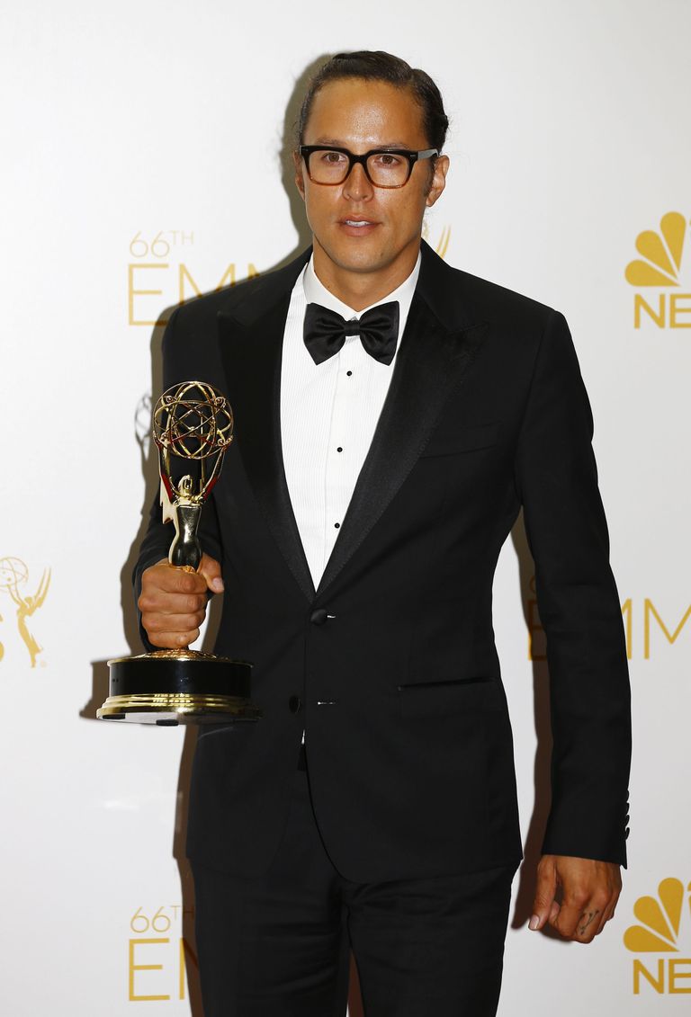 Cary Joji Fukunaga poses with his Outstanding Directing in a Drama Series award for HBO's "True Detective" at the 66th Primetime Emmy Awards in Los Angeles, California August 25, 2014. REUTERS/Mike Blake (UNITED STATES -Tags: ENTERTAINMENT)(EMMYS-BACKSTAGE)
