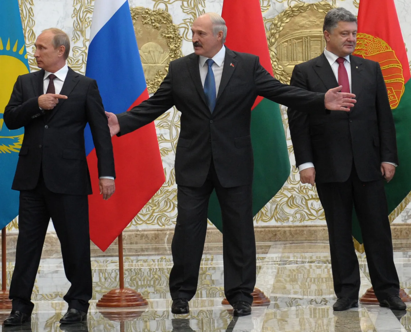 Vene president Vladimir Putin, kohtumist vahendanud Valgevene president Aleksandr Lukašenka ja Ukraina president Petro Porošenko eile Minskis.