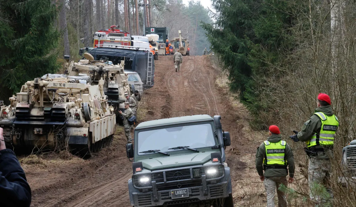 Military personnel searching the site of a rescue operation for missing U.S. soldiers at Pabrade training ground, in Lithuania, on March 28, 2025.