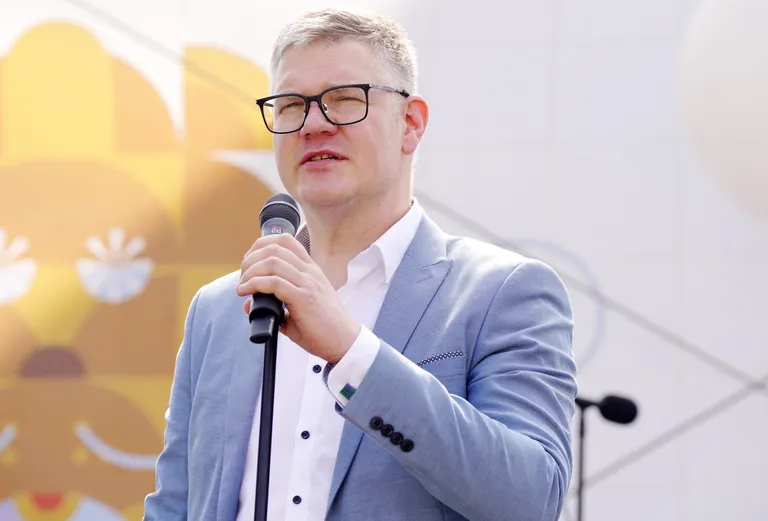 Riga City Council President Vilnis Kirsis addresses the audience at the opening of Riga's 822nd birthday celebrations in Town Hall Square.