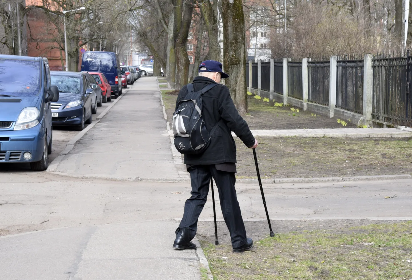 Vīrietis ar spieķi.