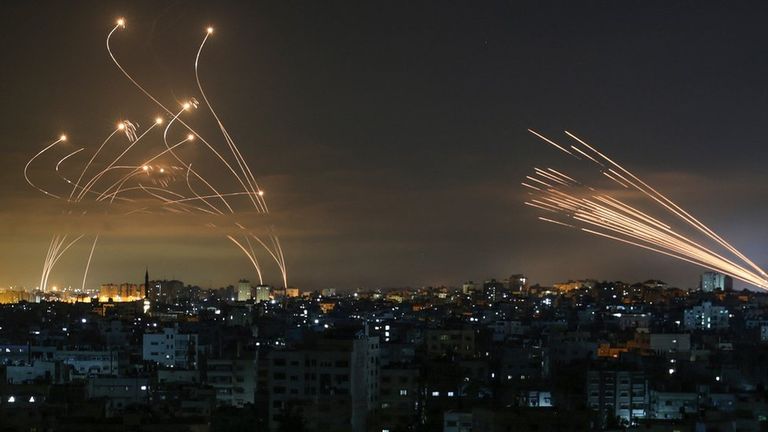 Rockets are seen in the night sky fired towards Israel from Beit Lahia in the northern Gaza Strip on May 14, 2021