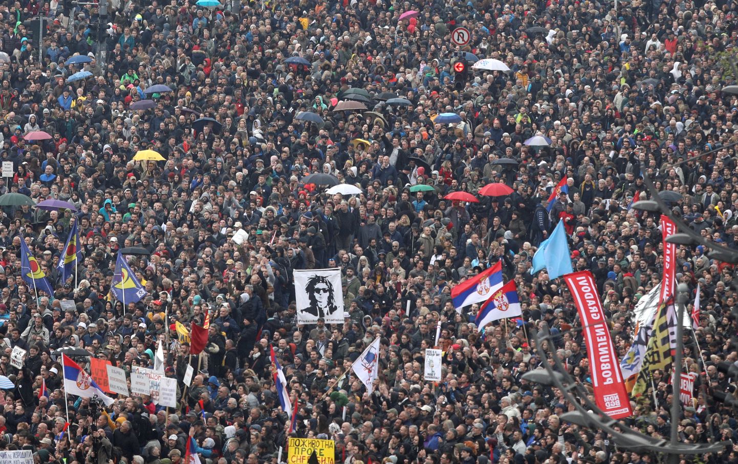 Demonstrators protest against Serbia's President Aleksandar Vucic and his government, in front of the Parliament Building in central Belgrade, Serbia, April 13, 2019. REUTERS/Djordje Kojadinovic