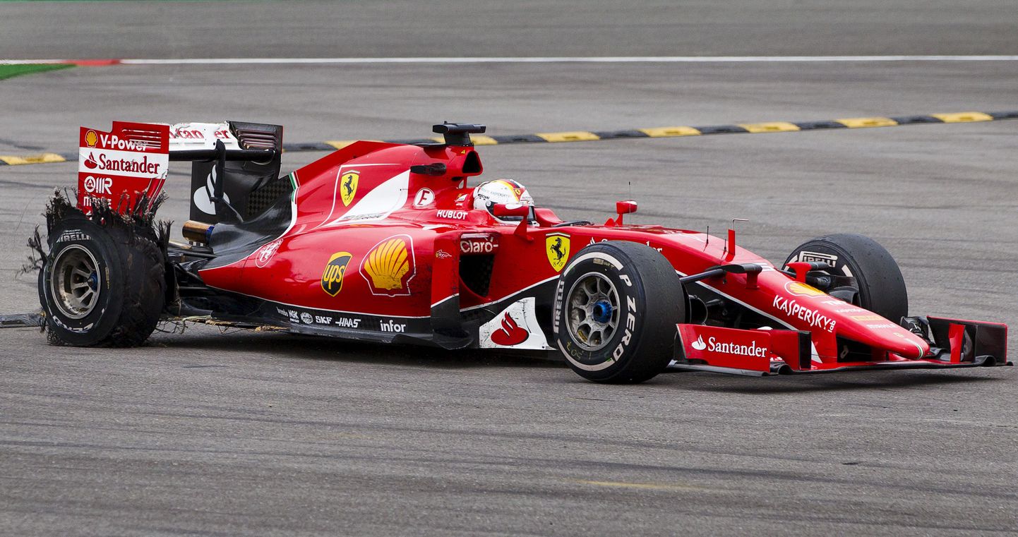 Sebastian Vettel katkise rehviga.