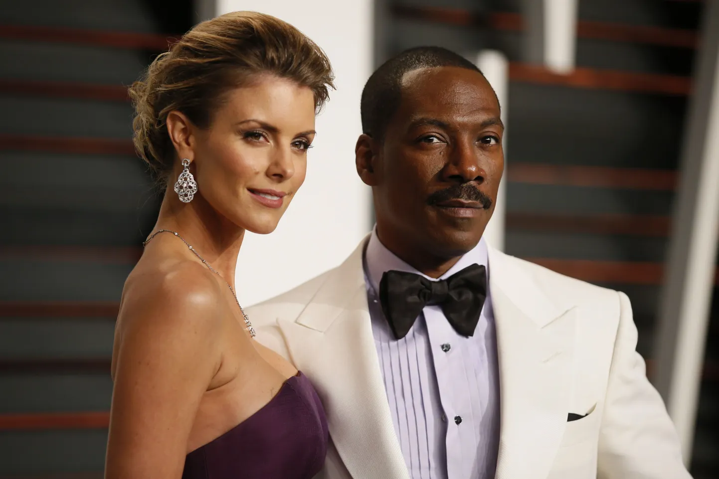 Comedian Eddie Murphy and Paige Butcher arrive 
at the 2015 Vanity Fair Oscar Party in Beverly Hills, California February 22, 2015.  REUTERS/Danny Moloshok (UNITED STATES  - Tags: ENTERTAINMENT) (VANITY FAIR-ARRIVALS)