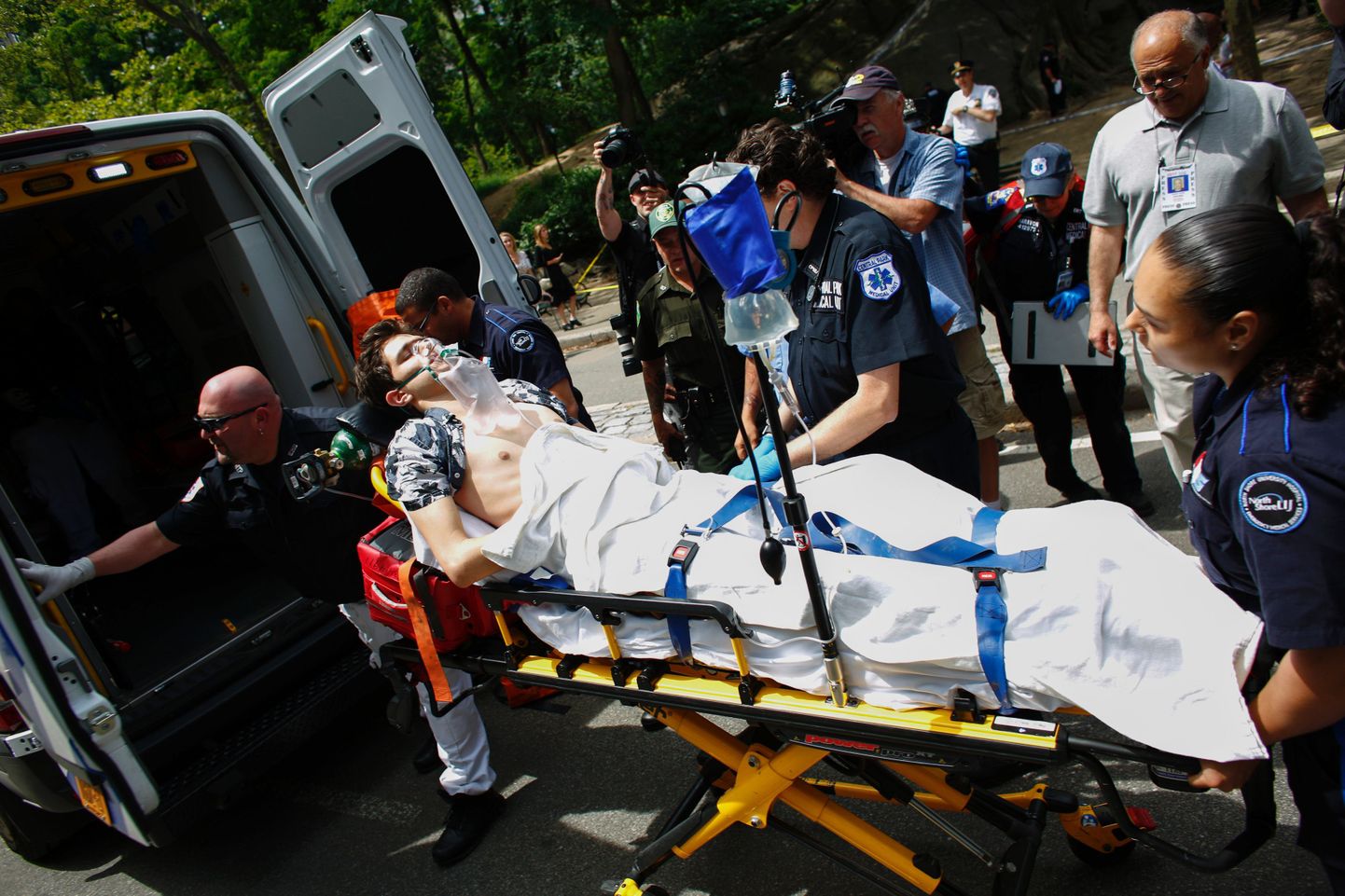 A critically injured man is placed on stretcher into an ambulance after an explosion at Central Park in New York on July 3, 2016.
The New York Police Department (NYPD) said one person was injured. No further details were immediately available.    / AFP PHOTO / KENA BETANCUR
