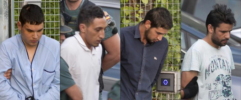 (COMBO) This combination of pictures created on August 22, 2017 shows (from L)Mohamed Houli Chemlal, Driss Oukabir, Salah El Karib, and Mohamed Aallaa, suspected of involvement in the terror cell that carried out twin attacks in Barcelona and Cambrils, escorded by Spanish Civil Guards from a detention center in Tres Cantos, near Madrid, on August 22, 2017 before being tranferred to the National Court.Under heavy security, police vans entered the National Court, which deals with terrorism cases, where a judge will question them and decide what -- if any -- charges to press against them over the vehicle attacks that left 15 dead and 120 injured. / AFP PHOTO / STRINGER