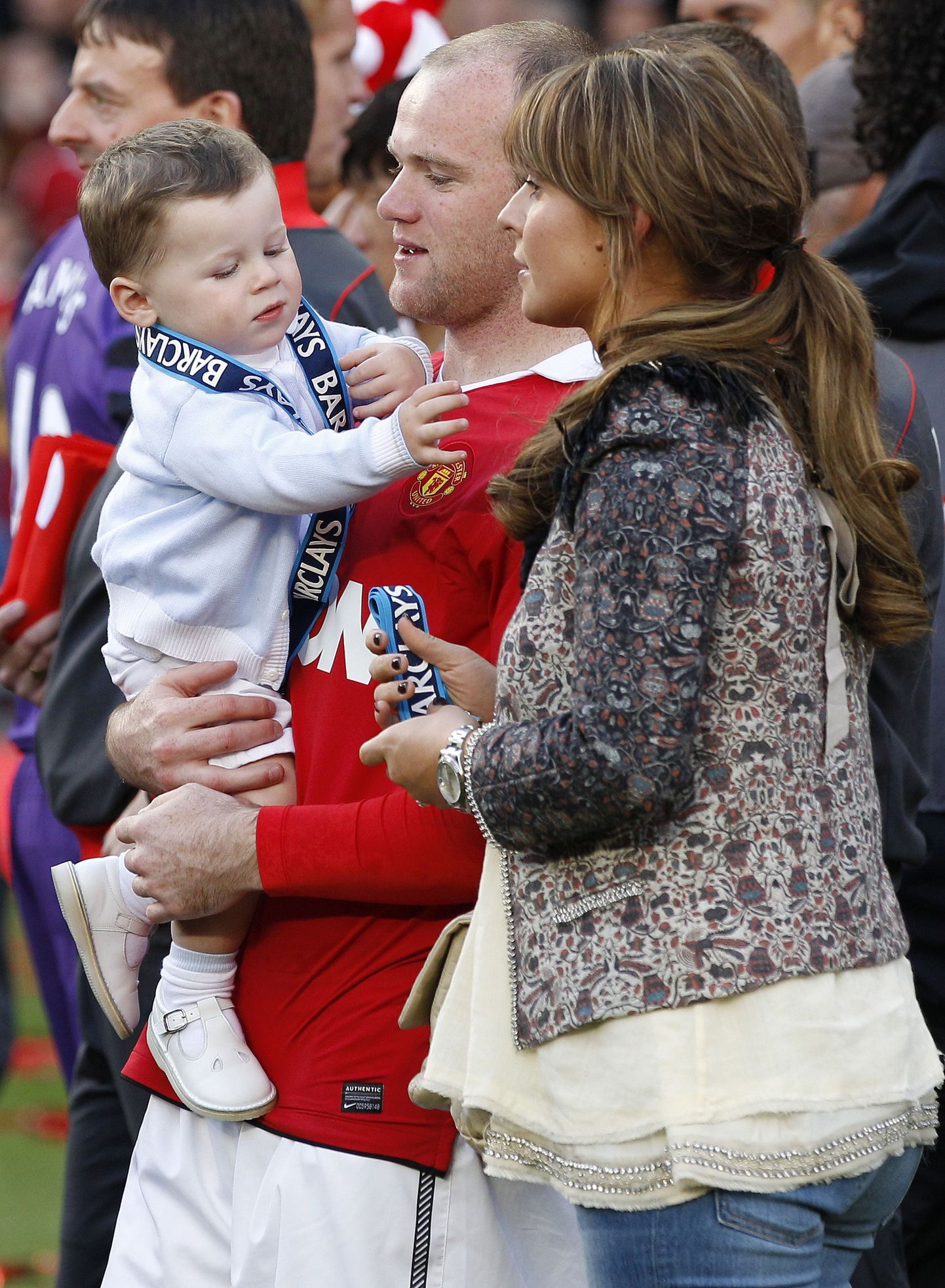 Wayne Rooney koos abikaasa Coleeni ja poja Kaiga.