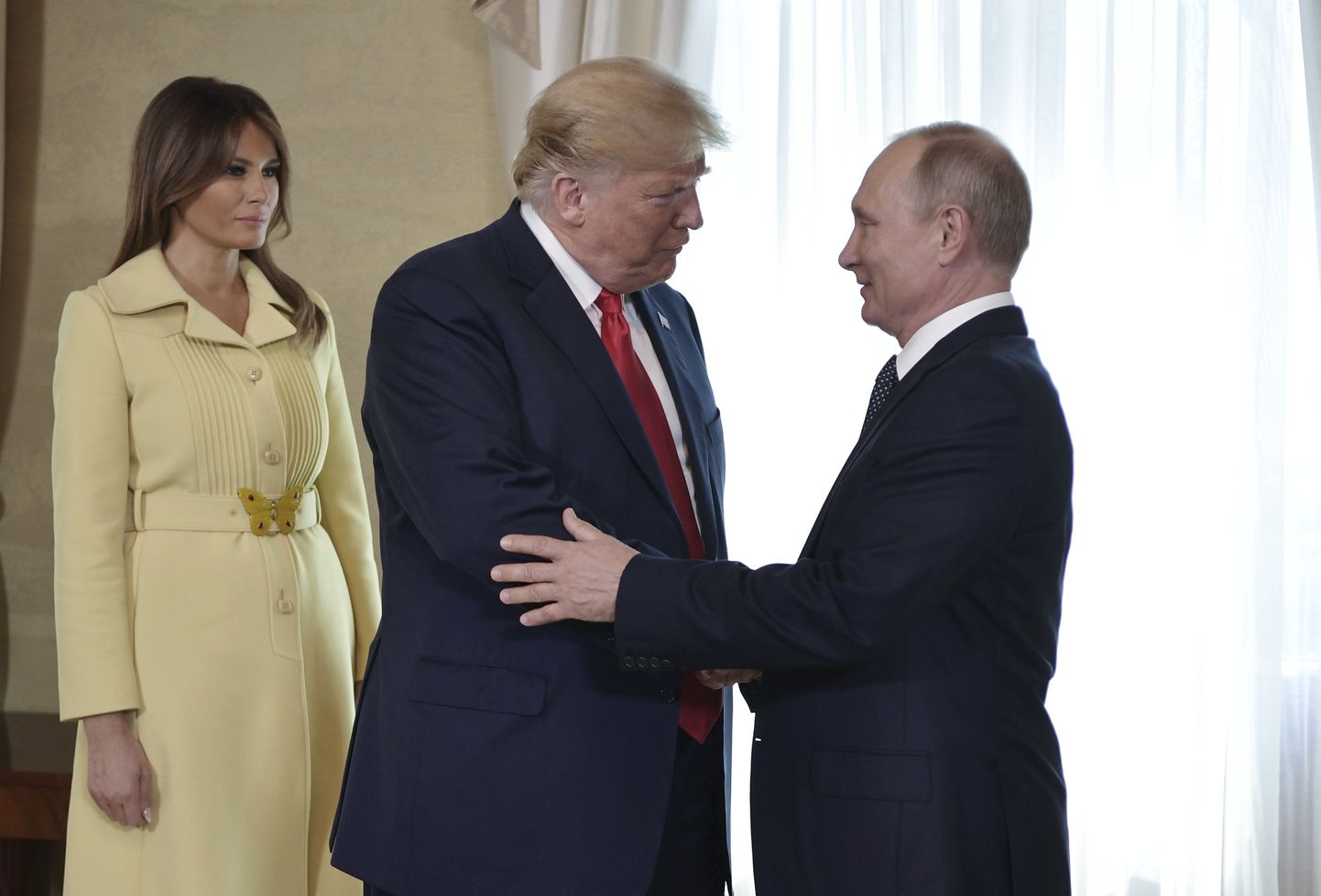 Президент США Дональд Трамп, первая леди Мелания Трамп и президент России Владимир Путин.