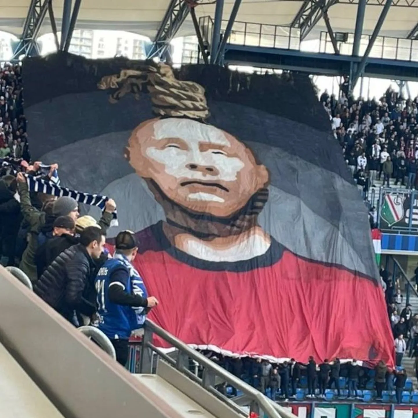 Plakat, millel on Vladimir Putini kaela ümber köis pandud.