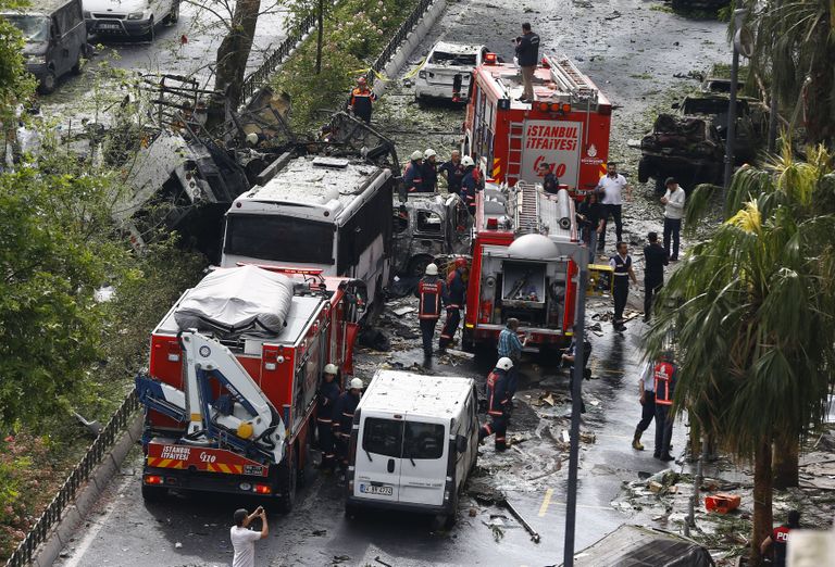 Fire engines stand beside a Turkish police bus which was targeted in a bomb attack in a central Istanbul district, Turkey, June 7, 2016.    REUTERS/Osman Orsal