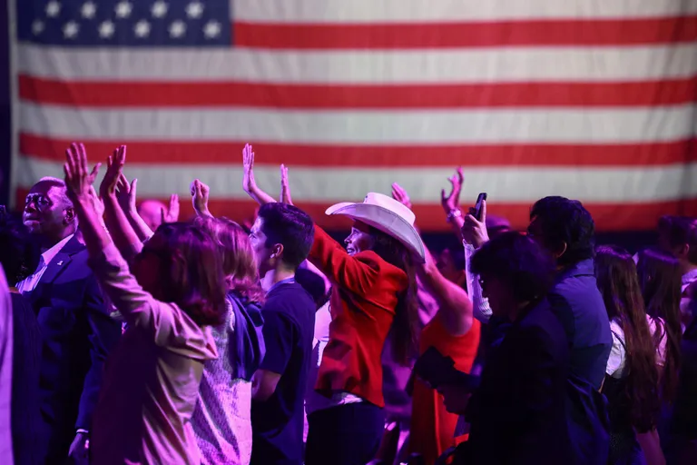 People pray during the start of the Turning Point USA Believers Summit conference where former President Donald Trump is scheduled to speak at the Palm Beach Convention Center on July 26, 2024, in West Palm Beach, Florida. Earlier in the day, Trump had met with Israeli Prime Minister Benjamin Netanyahu at Mar-a-Lago.