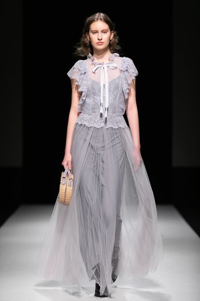 Платье Кати и сумочка Мишель на одном из показов Рижской недели моды