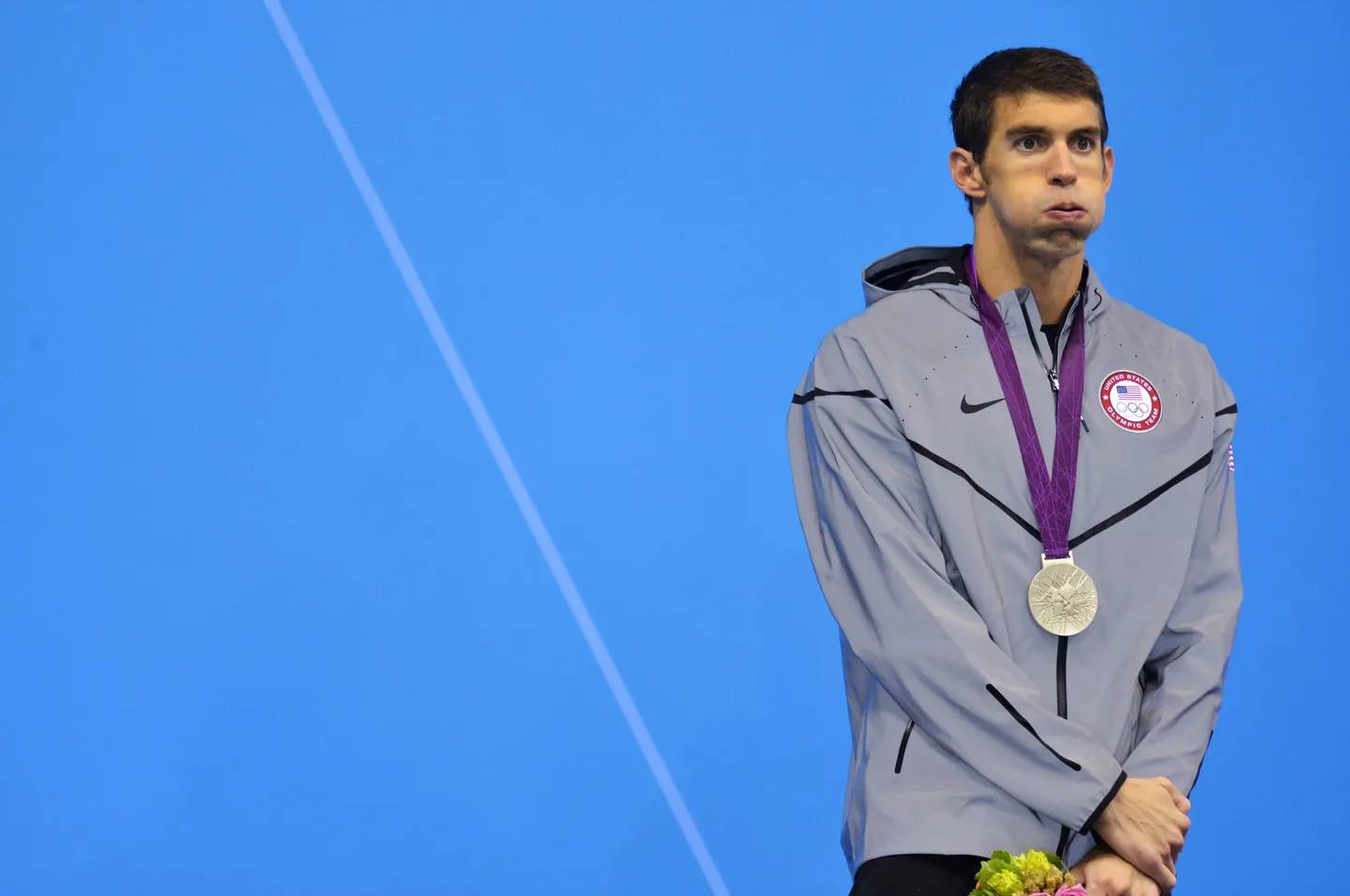 Michael Phelpsi nägu 2012. aasta olümpiamängudel pärast 200 m liblikujumisel saadud hõbemedalit on kõike muud kui rõõmus.