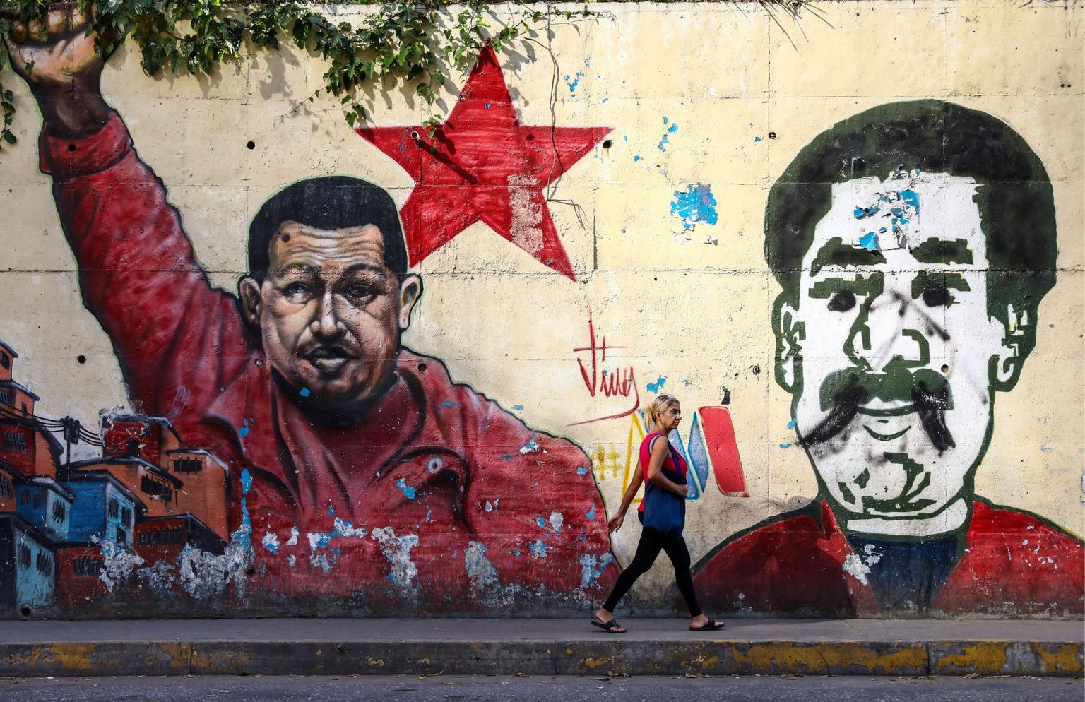Graffiti Hugo Cháveze (vasakul) ja Nicolás Maduro nägudega.