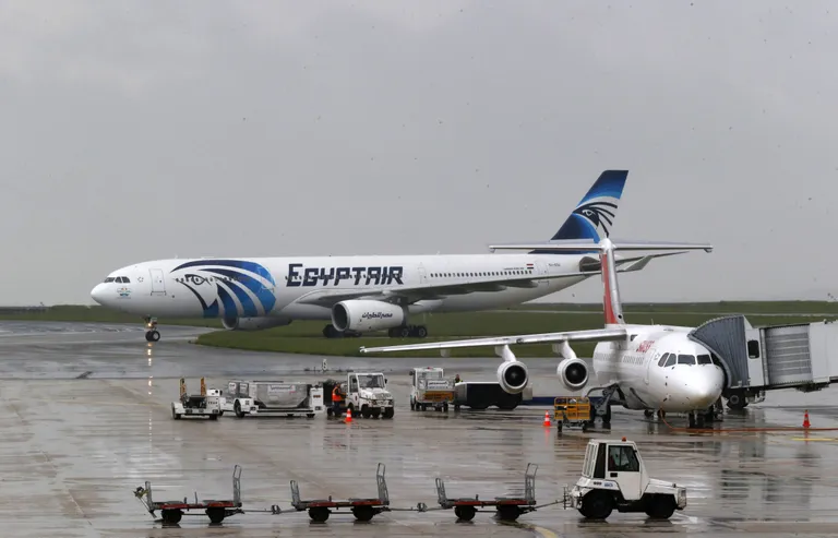 An EgyptAir Airbus A330-300 coming from Cairo rolls on the tarmac at Charles de Gaulle Airport outside of Paris, Thursday, May 19, 2016. An EgyptAir flight from Paris to Cairo with 66 passengers and crew on board crashed in the Mediterranean Sea early Thursday morning off the Greek island of Crete, Egyptian and Greek officials said. (AP Photo/Michel Euler)