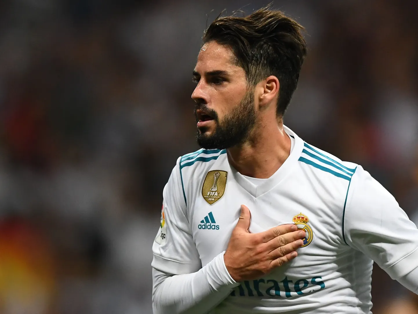 Real Madrid's midfielder Isco celebrates his second goal during the Spanish league football match Real Madrid CF vs RCD Espanyol at the Santiago Bernabeu stadium in Madrid on October 1, 2017. / AFP PHOTO / GABRIEL BOUYS