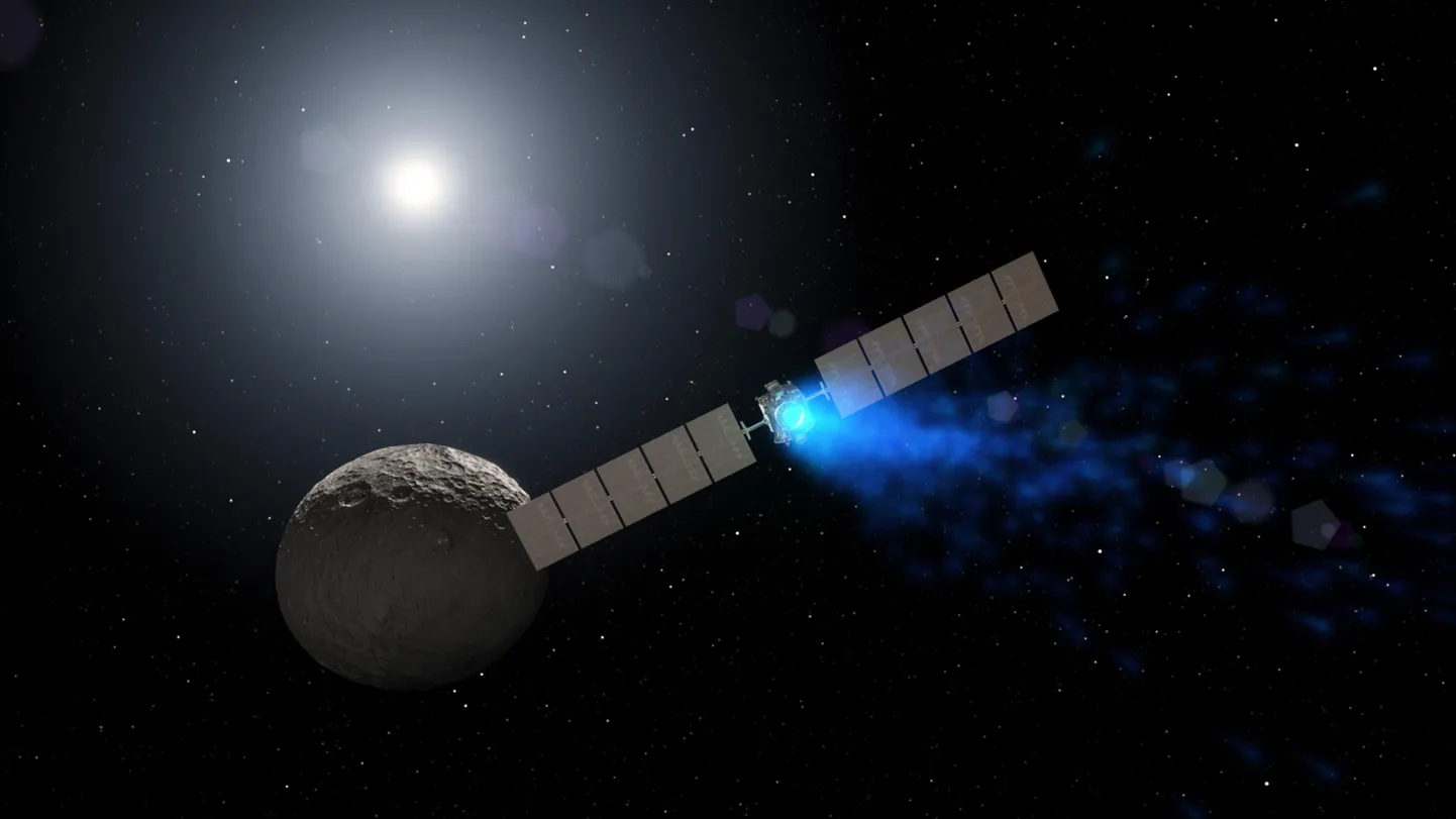 NASA illustratsioon Dawni kosmoseaparaadist kääbusplaneet Cerese taustal.
