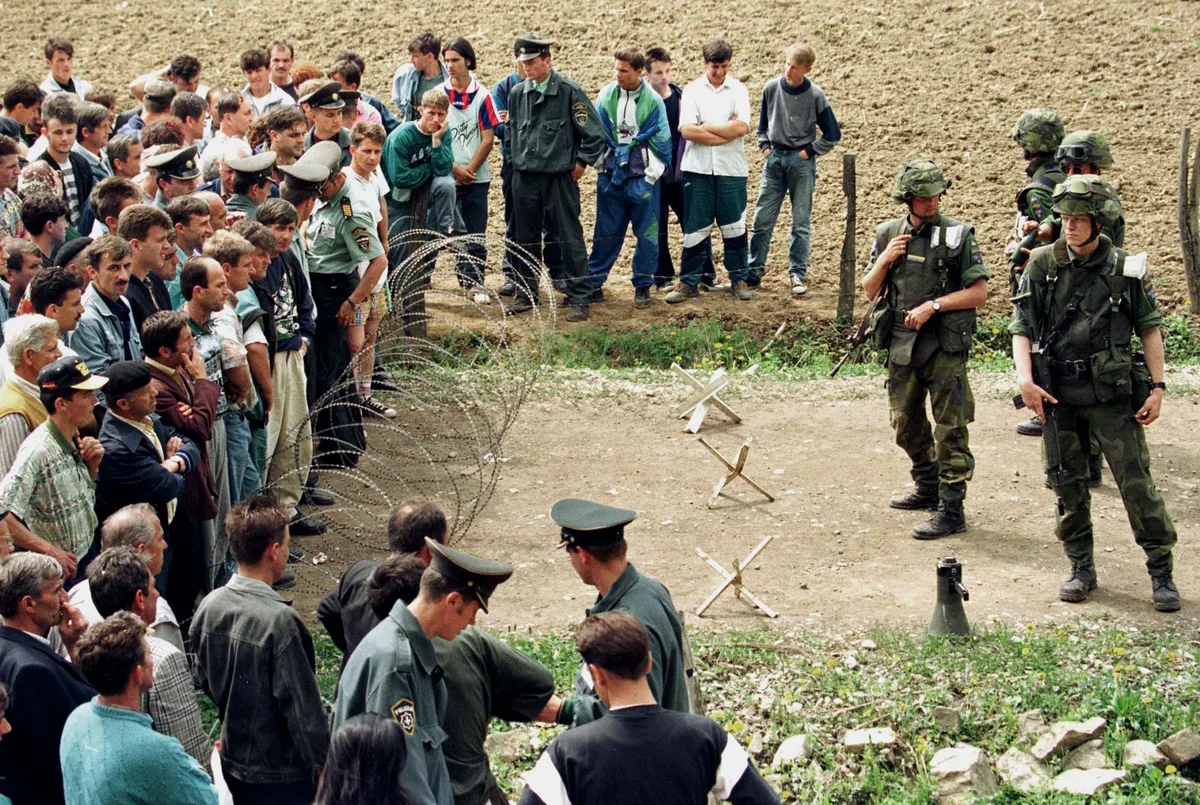 Swedish IFOR (Implementation Force) soldiers try unsuccesfully to stop a crowd of Bosnian refugees trying to return to their homes in the village of Sjenina in northern Bosnia.