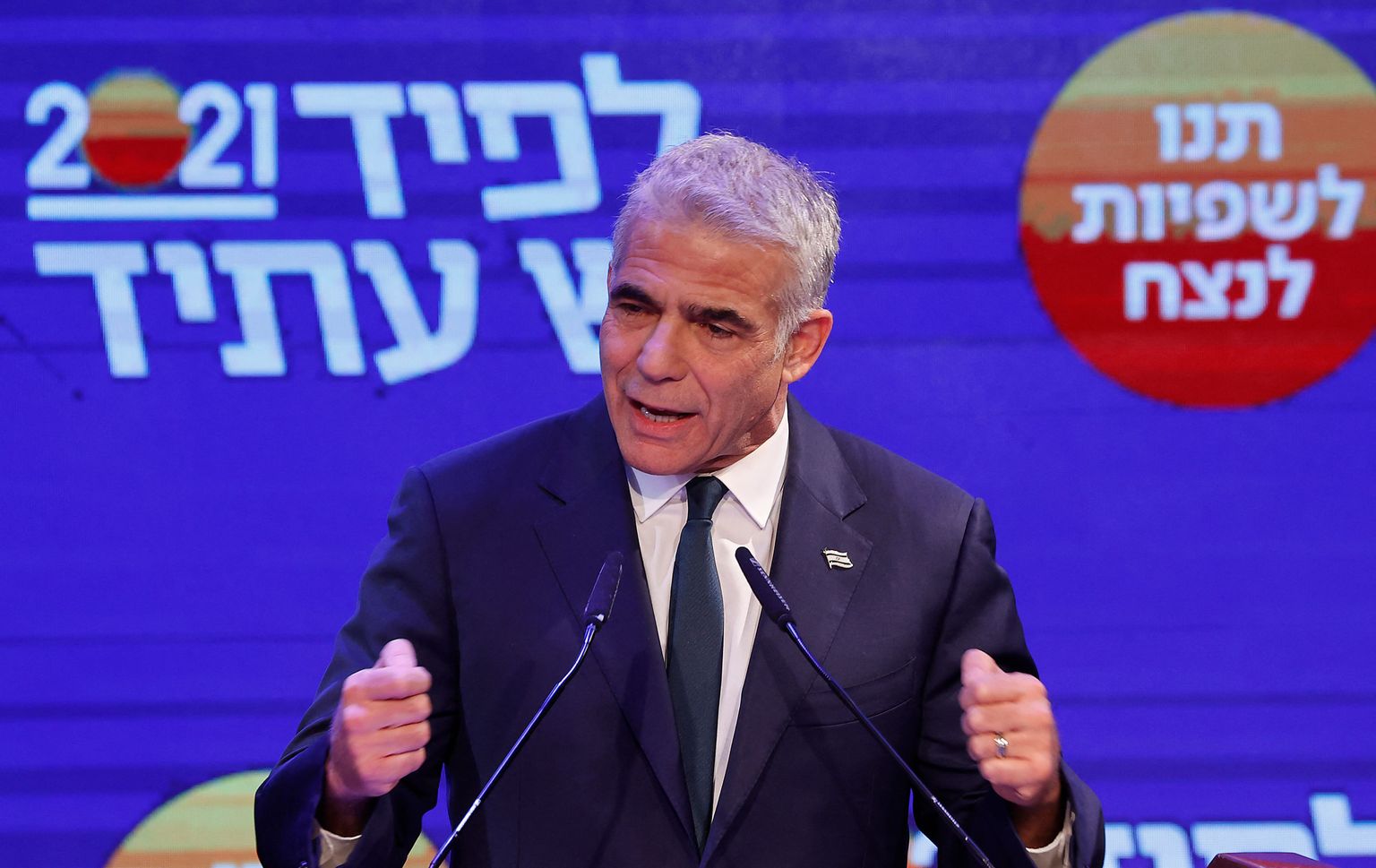 Yair Lapid, leader of Israel's Yesh Atid party, addresses supporters from his campaign headquarters in the Mediterranean coastal city of Tel Aviv early on March 24, 2021, after the end of voting in the fourth national election in two years. (Photo by JACK GUEZ / AFP)