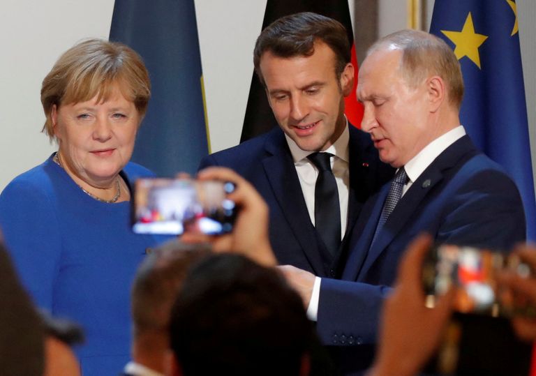 Ангела Меркель, Эммануэль Макрон и Путин в Париже в 2019 году.
