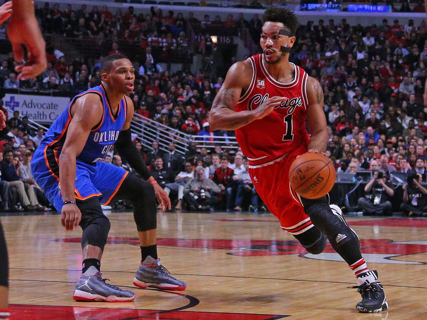 Nov 5, 2015; Chicago, IL, USA; Chicago Bulls guard Derrick Rose (1) dribble the ball around Oklahoma City Thunder guard Russell Westbrook (0) during the second half at the United Center. The Bulls won 104-98. Mandatory Credit: Dennis Wierzbicki-USA TODAY Sports