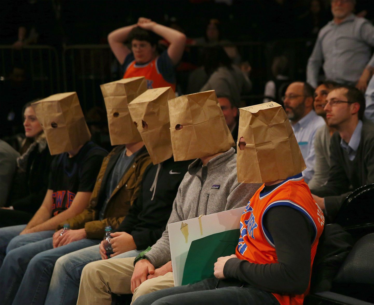 NEW YORK, NY - JANUARY 08: New York Knicks fans wear bags over their heads and react as the New York Knicks lose at Madison Square Garden on January 8, 2015 in New York City.The Houston Rockets defeated the New York Knicks 120-96. NOTE TO USER: User expressly acknowledges and agrees that, by downloading and/or using this photograph, user is consenting to the terms and conditions of the Getty Images License Agreement.   Elsa/Getty Images/AFP
== FOR NEWSPAPERS, INTERNET, TELCOS & TELEVISION USE ONLY ==