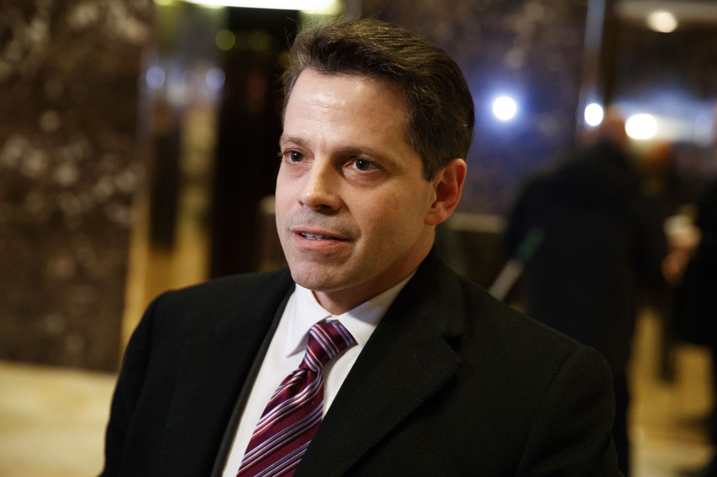 Anthony Scaramucci, a senior adviser to President-elect Donald Trump, talks to reporters in the lobby of Trump Tower in New York, Friday, Jan. 13, 2017. (AP Photo/Evan Vucci)