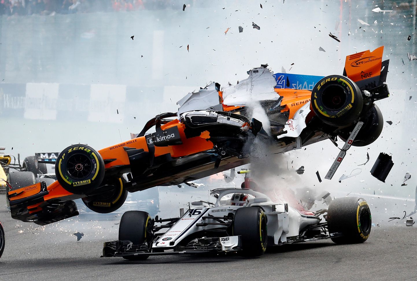 Formula One F1 - Belgian Grand Prix - Spa-Francorchamps, Stavelot, Belgium - August 26, 2018. McLaren's Fernando Alonso and Sauber's Charles Leclerc crash at the first corner.  REUTERS/Francois Lenoir TPX IMAGES OF THE DAY